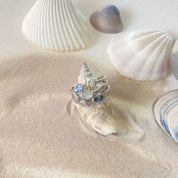 bague en argent avec pierre de nacre et oxydes bleu