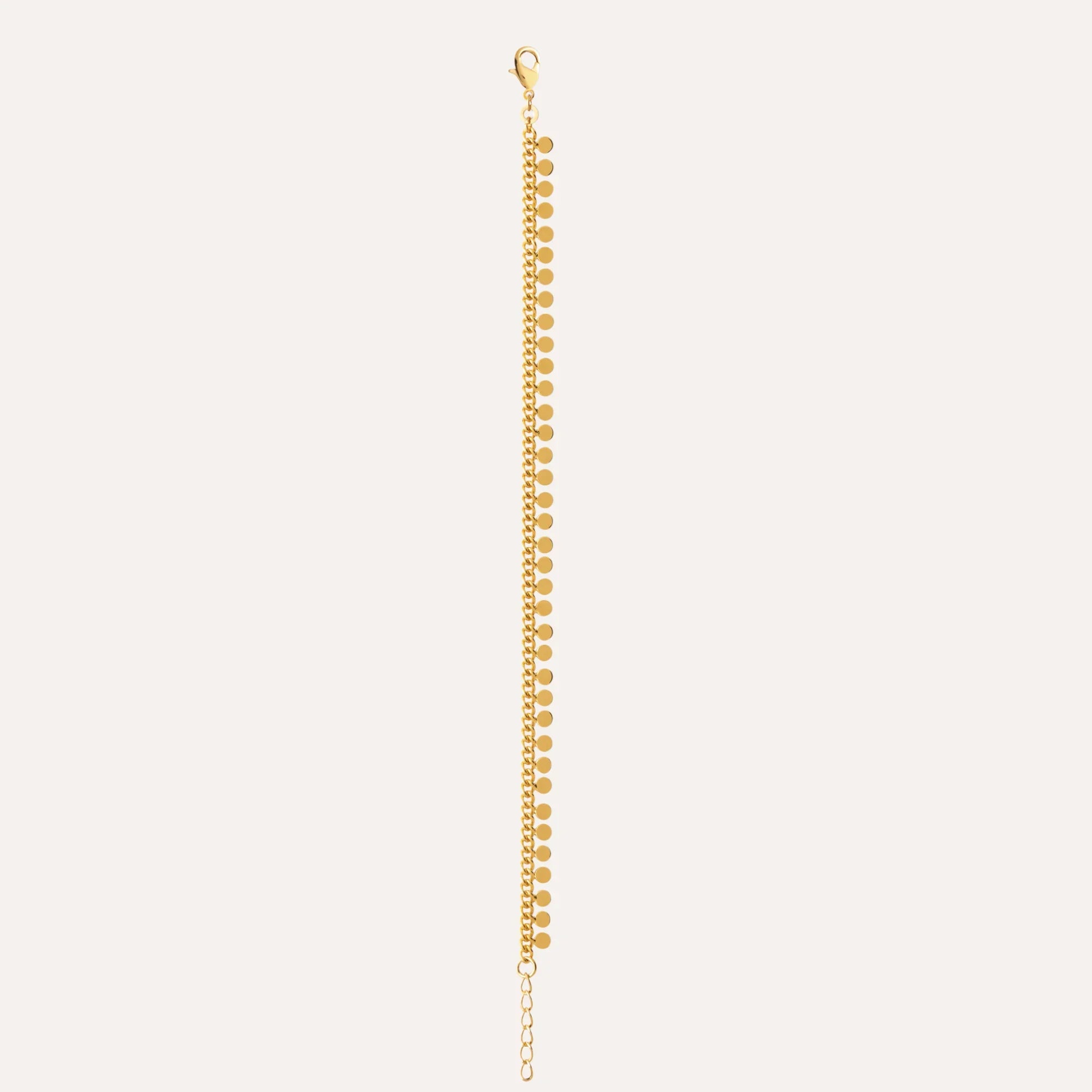 Bracelet plaqué or à chaînons et pastilles, fermoir discret.