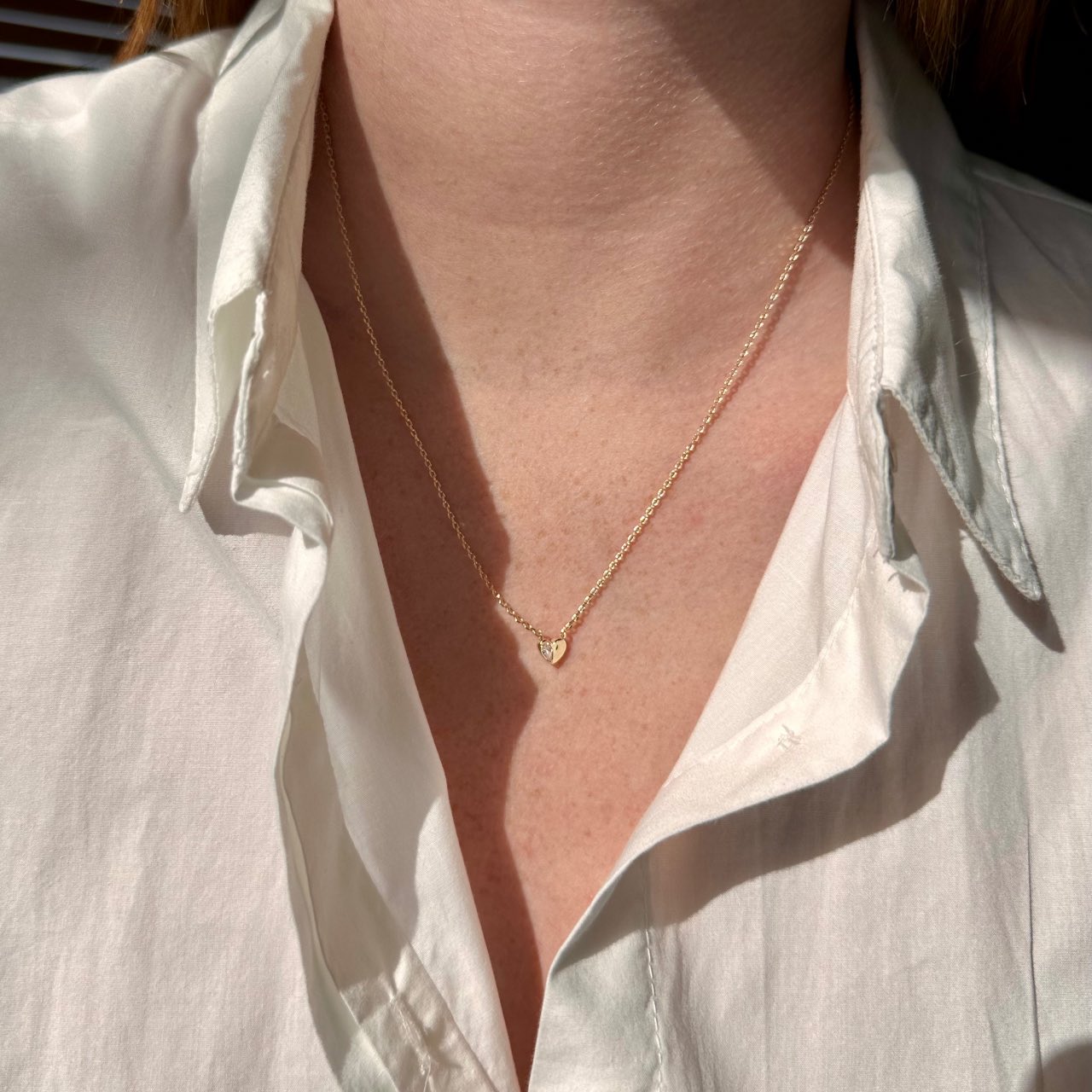 Collier plaqué or petit coeur serti d'un zircon