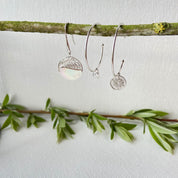 composition de boucles d'oreilles argent et nacre