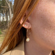 Créoles fines ouvertes plaqué or forme soleil