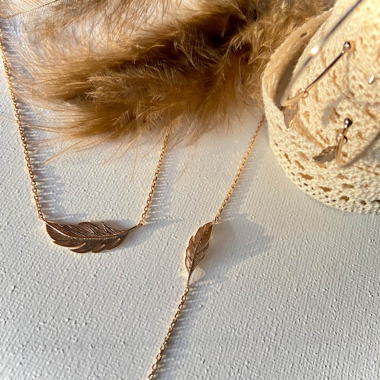Collier et bracelet plaqué or plume